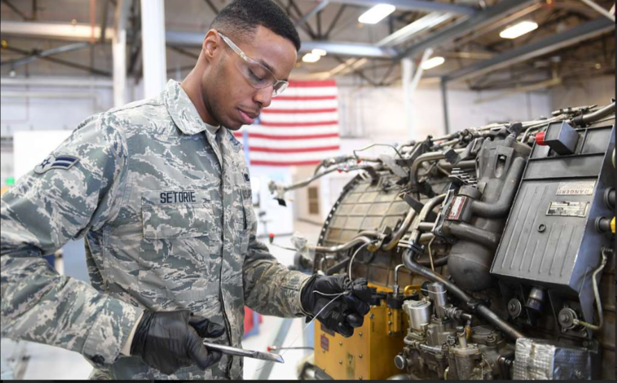 Aircraft maintenance technician inspecting equipment